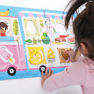 Banana Panda Make-a-Match Food Truck Toddler Puzzle, being played with