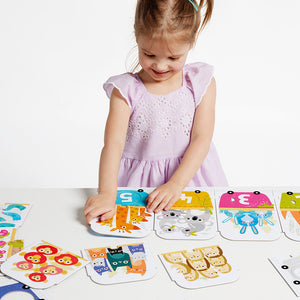 Banana Panda Make-a-Match Number Train Puzzle, being played with
