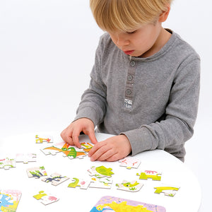 Banana Panda On-the-Go Travel Puzzles Dinosaurs, being played with